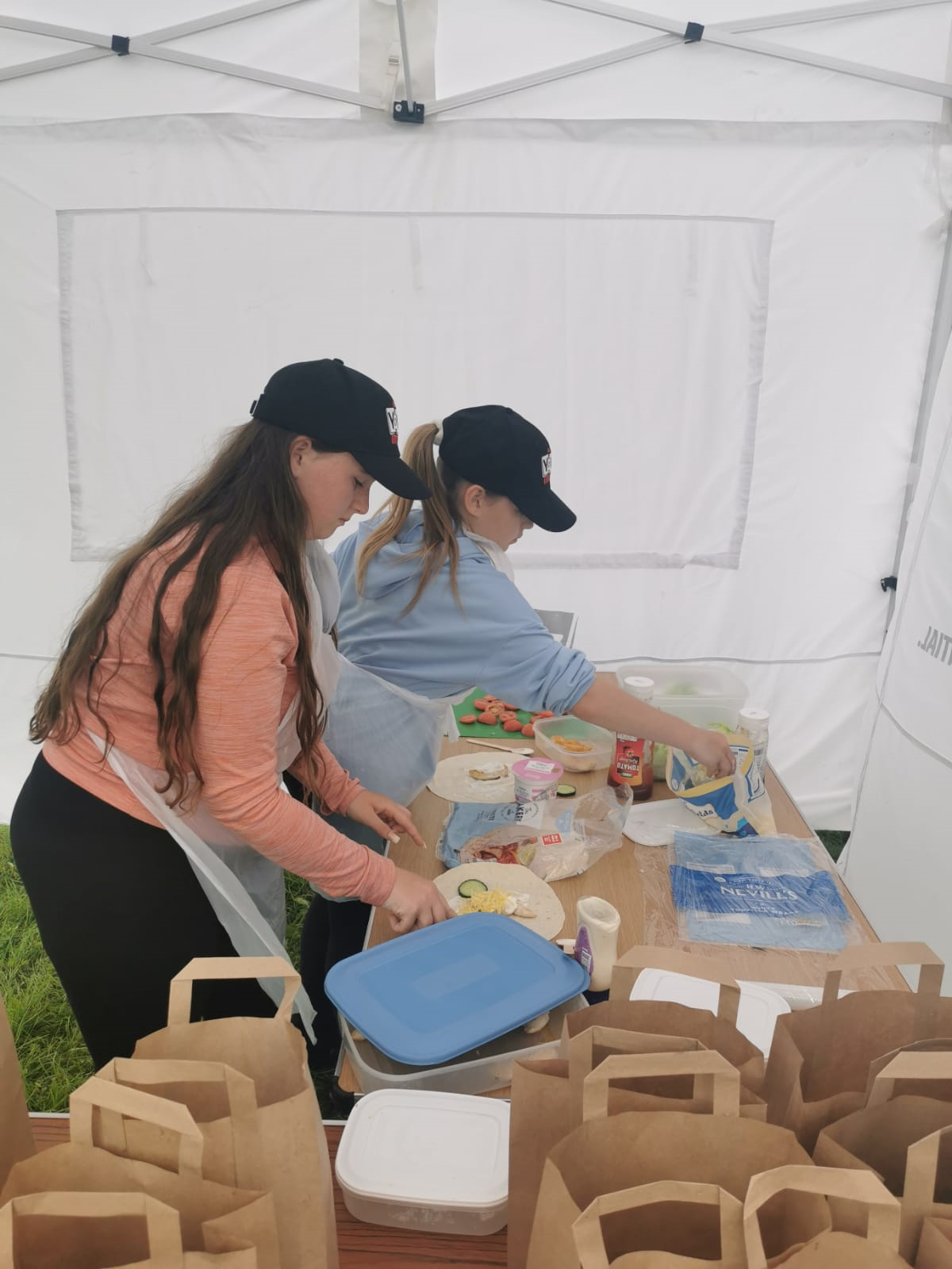 Two girls prepping food