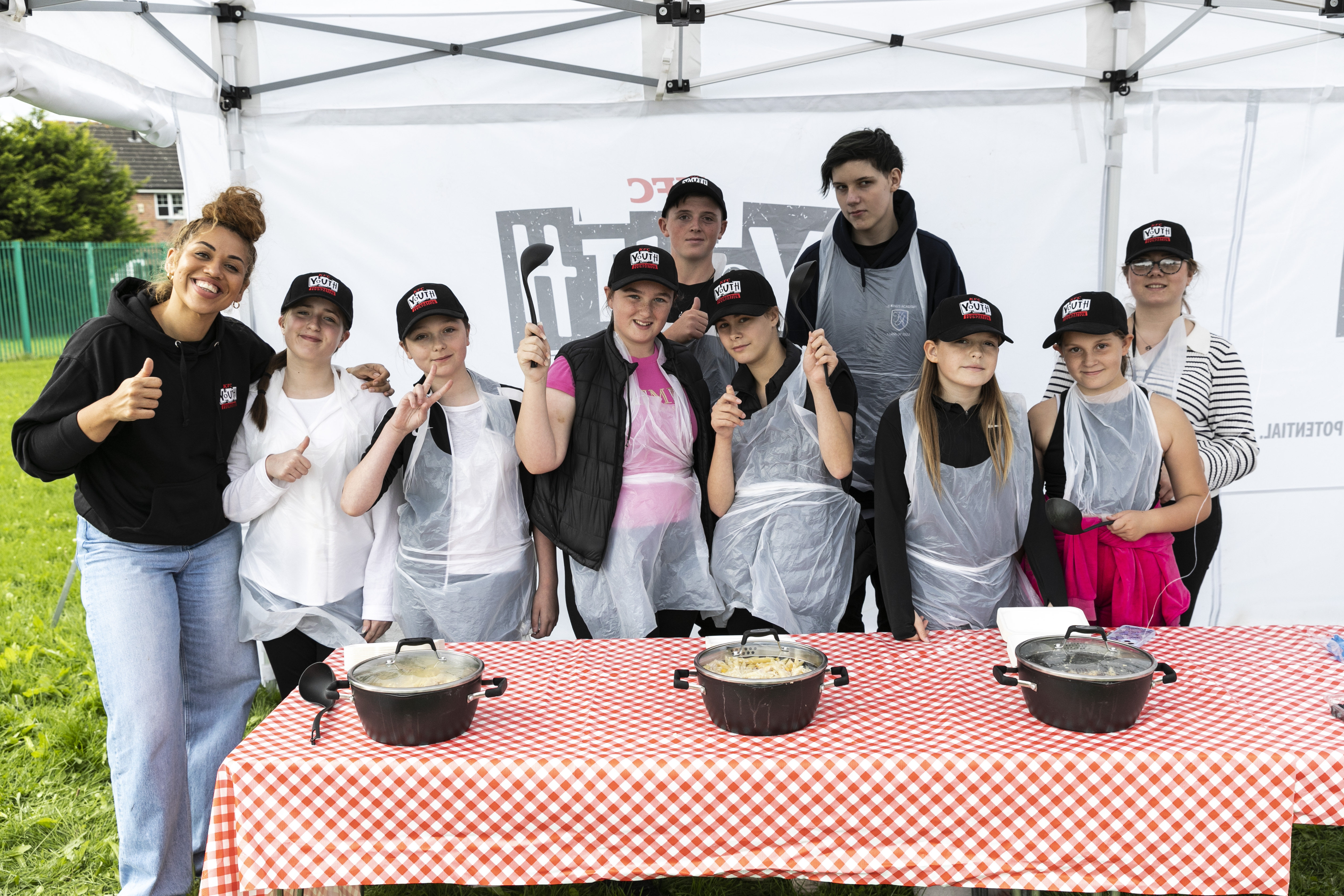 Young people in a group with their finished recipes on display